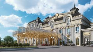 duży biały budynek z dużą metalową konstrukcją w obiekcie GoldenEye Hotel & Casino w mieście Swilengrad