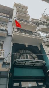 a red sign on the side of a building at Yen’s House in Hanoi