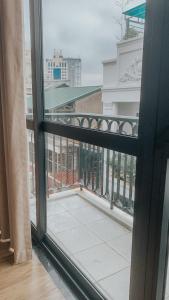 a view from a window of a balcony at Yen’s House in Hanoi