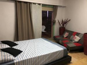 Un pat sau paturi într-o cameră la Apartment Majorelle Garden With Pool