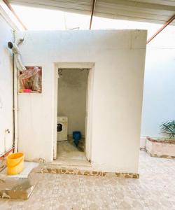 a room with a white wall and a doorway at vibrant bright house of La Marsa in La Marsa
