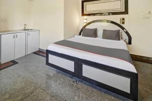 Katil atau katil-katil dalam bilik di Sabharwal Residency Near Lalbagh Botanical Garden