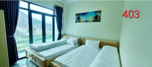 Postel nebo postele na pokoji v ubytování NHÀ NGHỈ ANH VĂN