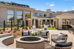 a house with a fire pit in the yard at CozySuites at Kierland Commons by golf course! in Scottsdale