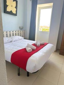 Postel nebo postele na pokoji v ubytování Barraca Suites