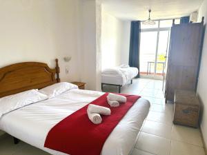 Postel nebo postele na pokoji v ubytování Barraca Suites