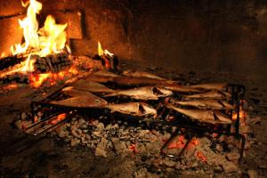 a bunch of fish on a grill in a fireplace at Seaside holiday house Cove Zarace - Gdinj, Hvar - 2048 in Gdinj