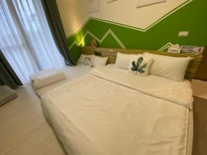 Postel nebo postele na pokoji v ubytování 寄居蟹民宿