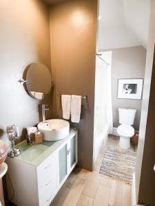 a bathroom with a sink and a toilet at Off Broadway B & B in Denver +61 photos