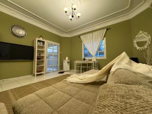 a bedroom with a large bed and a television at Beautiful 1BHK Near Jumeirah near Metro 3mins walk in Dubai