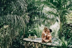 a man and a woman sitting next to each other at ANAND Ecoaldea in Puerto Morelos