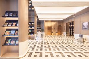 a view of a wine store with a lobby at Atour Hotel Meizhou Meixian Baili Plaza in Meizhou