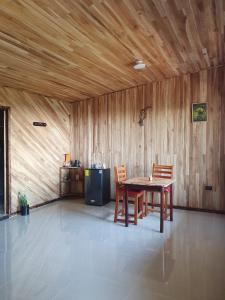 a dining room with a table and two chairs at El Chagüite monteverde #2 in Monteverde Costa Rica
