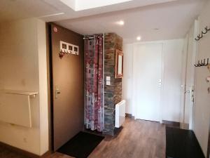 a hallway with a stone wall in a room at Appartement Saint-François-Longchamp, 3 pièces, 6 personnes - FR-1-635-136 in Saint-François-Longchamp