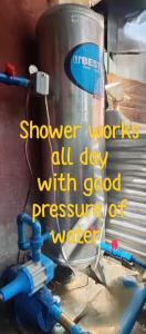 a watermill with the words shower works all day with good pressure water at Ustaris Homestay in Itaytay