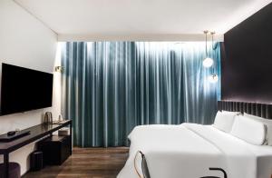 Postel nebo postele na pokoji v ubytování H Hotel Wangsimni + 8 fotografií