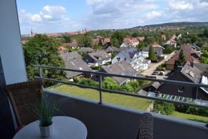 a balcony with a view of a town at Ferienwohnung Am Steinberg in Hildesheim