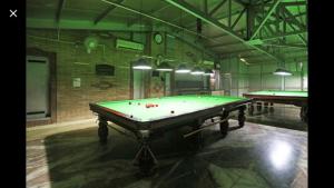 a billiard room with a pool table in it at Hotel Sterling , Srinagar in Srinagar