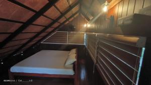 Łóżko lub łóżka w pokoju w obiekcie Tree House Wayanad