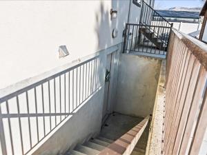 a stairway with a railing next to a building at Heber Apartment Hideaway in Heber City