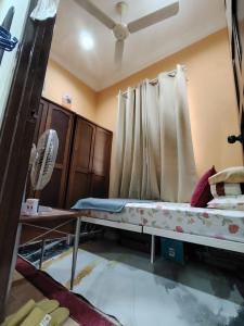 Katil atau katil-katil dalam bilik di Sri MaLati Homestay and Event Space