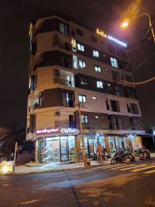 a building on a city street at night at LaLa Apartment and Hotel in Da Nang