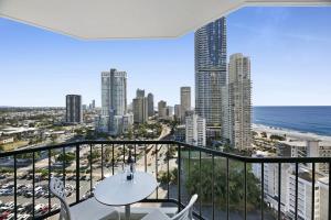 a balcony with a view of the beach and buildings at Ocean View 2-Bed Studio In the Heart of Surfers in Gold Coast