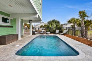 a swimming pool in the backyard of a house at The Minty Pearl in Mexico Beach