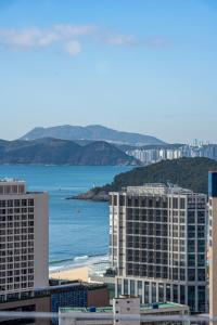a view of the ocean and buildings on the beach at Haeundae Chocho stay 2 in Busan