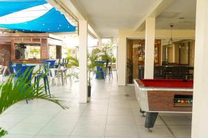 a pool table in the middle of a restaurant with a pool table at Parc Rayne in Georgetown