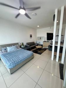 a bedroom with a bed and a ceiling fan at Modern Studio @Evo #4pax in Bandar Baru Bangi