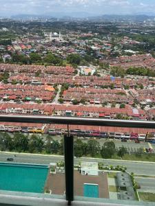an aerial view of a city with a train at Modern Studio @Evo #4pax in Bandar Baru Bangi