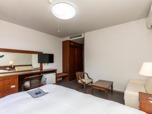 Postel nebo postele na pokoji v ubytování Tabist Kotohikisou