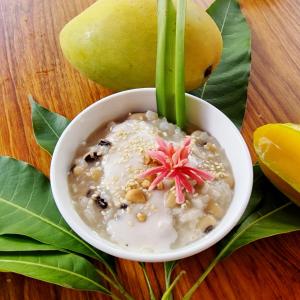 a bowl of oatmeal with a flower on top of it at Masawi Home in Can Tho
