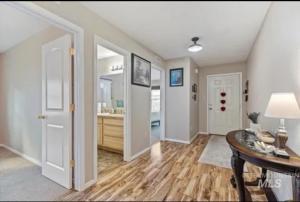 a living room with a table and a hallway at Peaceful living in Star