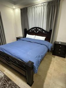 Ένα ή περισσότερα κρεβάτια σε δωμάτιο στο Amro Petra Apartment