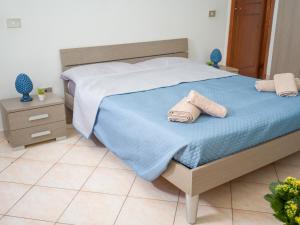 Postel nebo postele na pokoji v ubytování Isola delle Femmine - Casetta del Pescatore