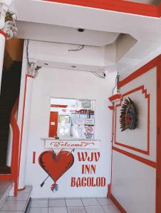 a room with a heart painted on the wall at WJV INN BACOLOD in Bacolod