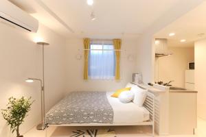 Postel nebo postele na pokoji v ubytování Hotel Dieu Nakanobu