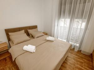 Postel nebo postele na pokoji v ubytování Kiko apartmani LUX