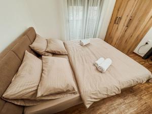 Postel nebo postele na pokoji v ubytování Kiko apartmani LUX