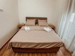 Postel nebo postele na pokoji v ubytování Kiko apartmani LUX