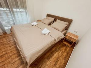 Postel nebo postele na pokoji v ubytování Kiko apartmani LUX