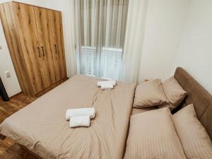 Postel nebo postele na pokoji v ubytování Kiko apartmani LUX