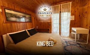 a bedroom with a king bed in a wooden room at Magic CHALET near COMO lake, private parking, total privacy I Villa dei Leoni in Morbio Inferiore