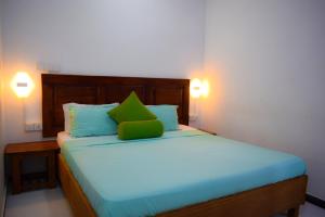Voodi või voodid majutusasutuse White Villa Hotel toas