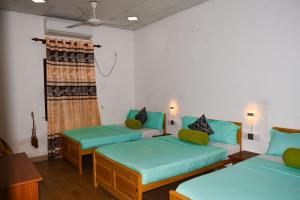 Voodi või voodid majutusasutuse White Villa Hotel toas