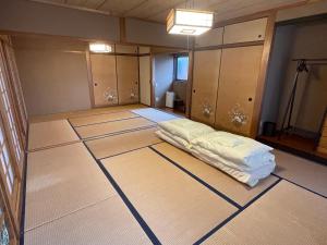 an empty room with a bed on the floor at YAKUSHIMA YUDOMARI443 in Yudomari