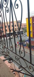 a metal fence with a view of a street at Magnifique appartement in Marrakesh
