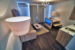 Televízia a/alebo spoločenská miestnosť v ubytovaní CASA V BENCUN Luxury Apartments